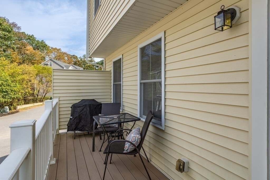 8 High Street, Unit D2 Acton, MA 01720 - Photo 27 of 35 a view of a patio with a table and chairs