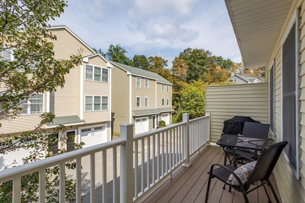8 High Street, Unit D2 Acton, MA 01720 - Photo 29 of 35 a view of balcony with wooden floor and seating space