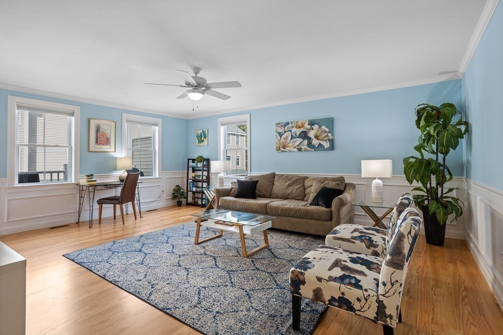 8 High Street, Unit D2 Acton, MA 01720 - Photo 5 of 35 a living room with furniture and wooden floor