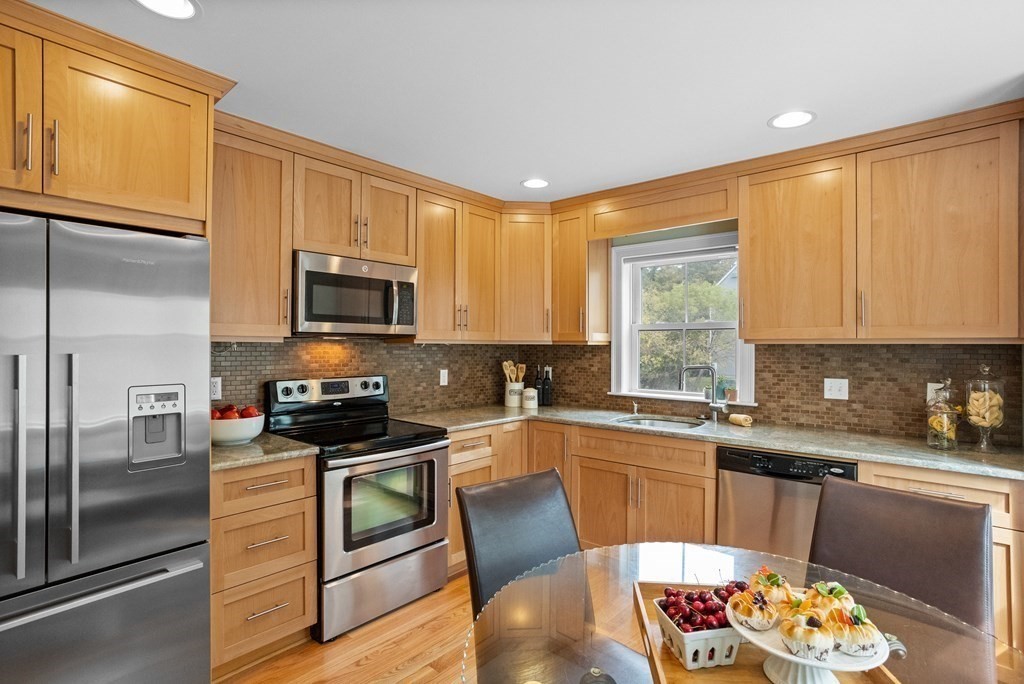 8 High Street, Unit D2 Acton, MA 01720 - Photo 8 of 35 a kitchen with a sink appliances cabinets and a counter top space