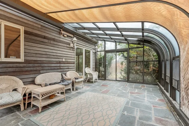 a view of an empty room with a balcony