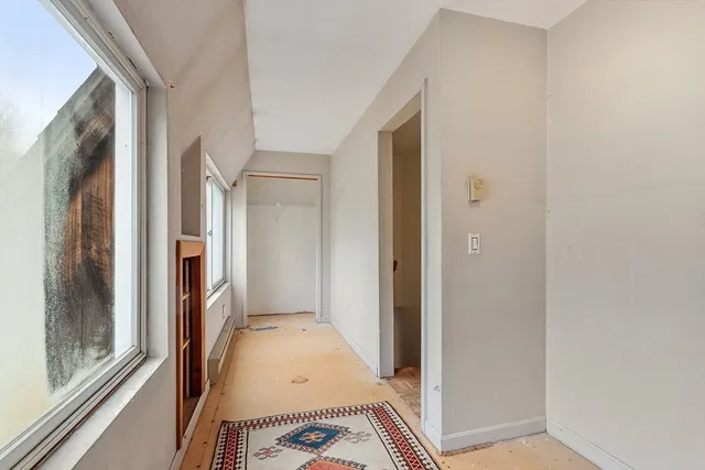 a view of a livingroom with furniture and a garage