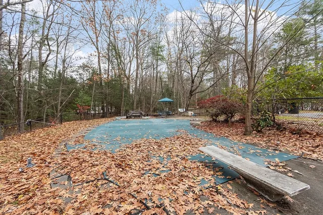 a backyard of a house with lots of green space
