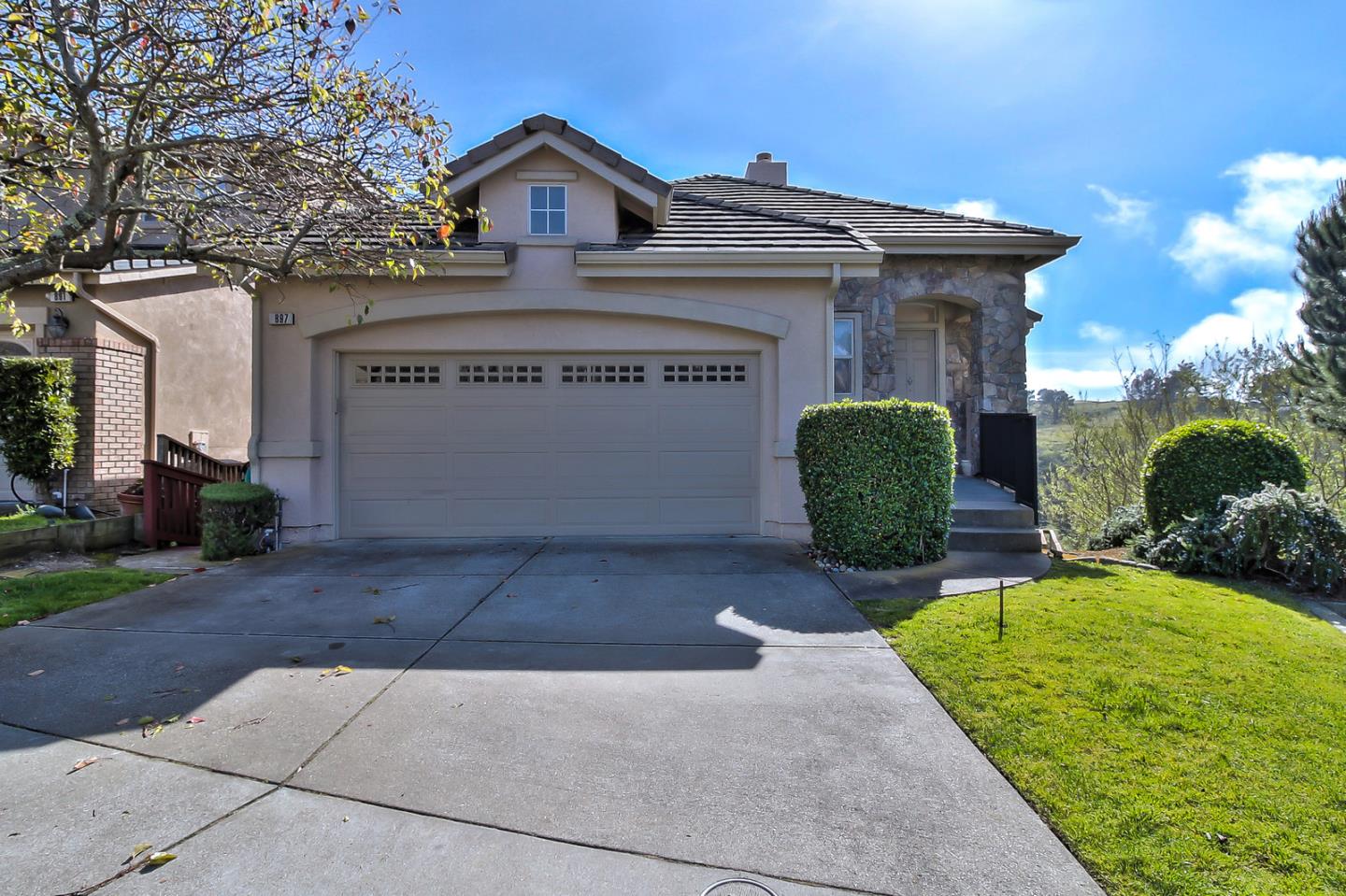a front view of a house with garden
