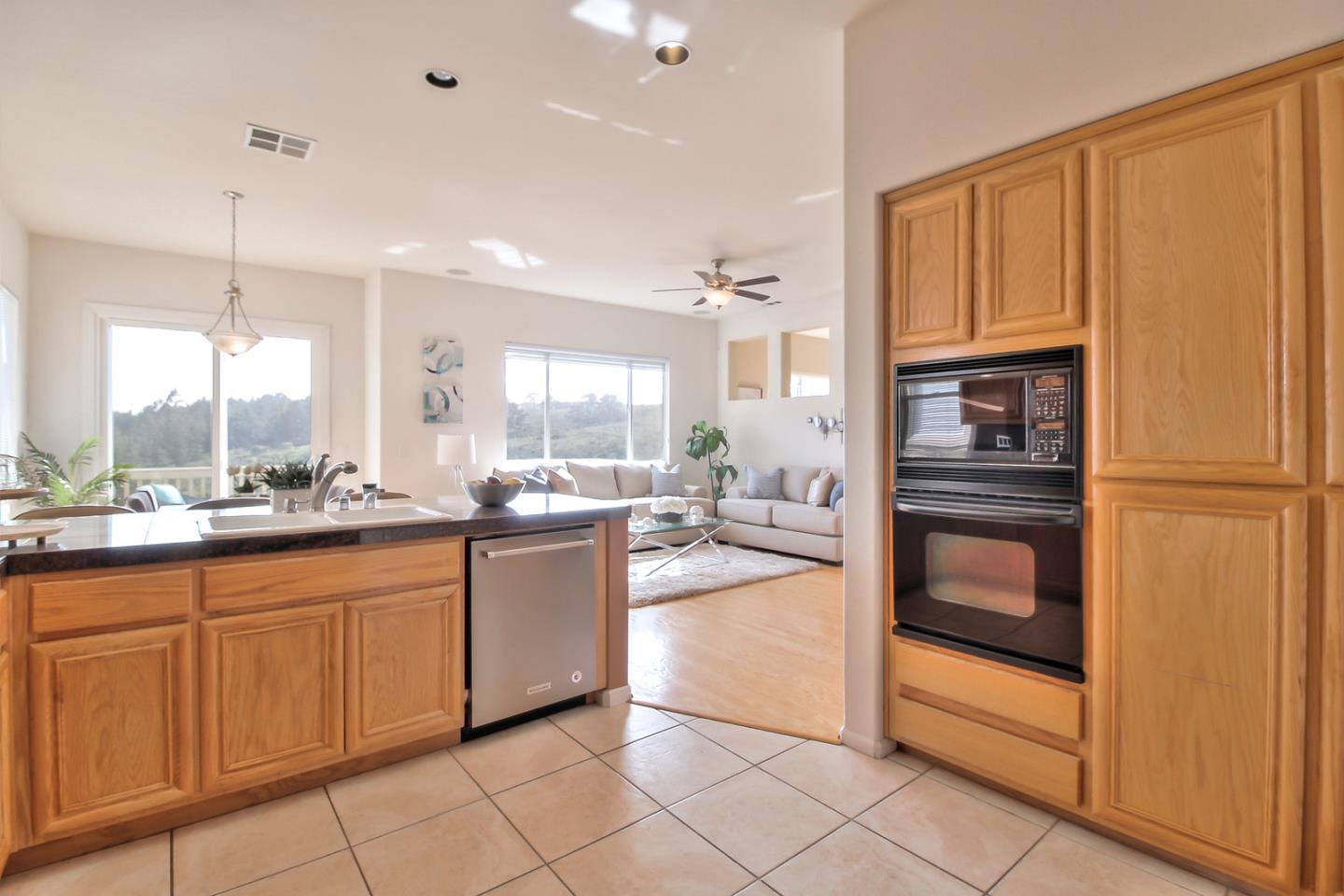 897 Skyridge Drive Pacifica, CA 94044 - Photo 15 of 37 a kitchen with stainless steel appliances granite countertop a refrigerator and a sink
