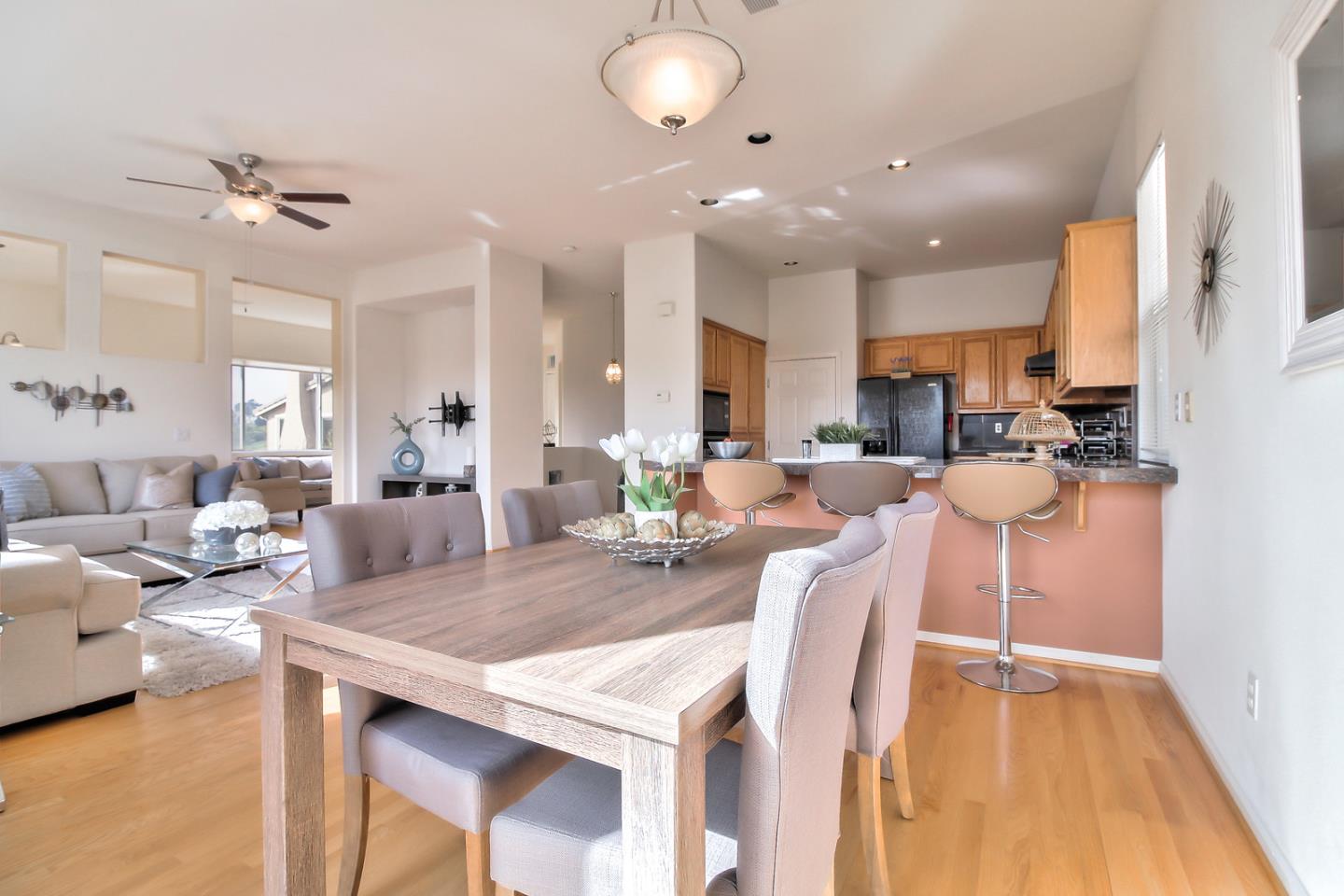897 Skyridge Drive Pacifica, CA 94044 - Photo 16 of 37 a living room with kitchen island furniture and a wooden floor