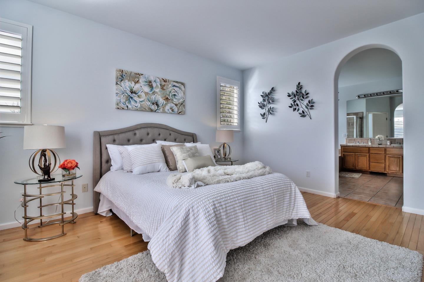 897 Skyridge Drive Pacifica, CA 94044 - Photo 20 of 37 a bedroom with bed and painting on the wall