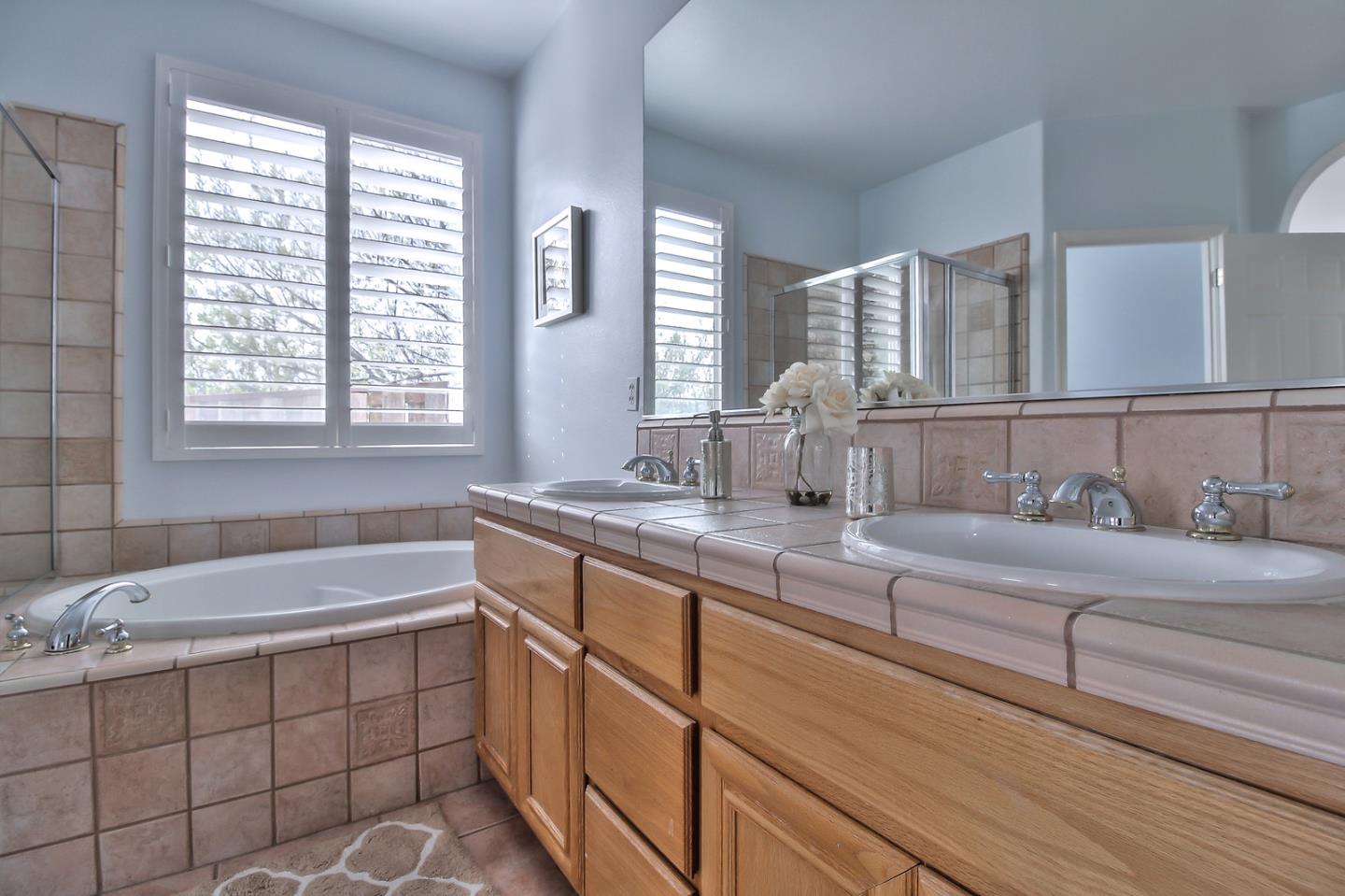 897 Skyridge Drive Pacifica, CA 94044 - Photo 22 of 37 a spacious bathroom with sinks mirror and a bathtub