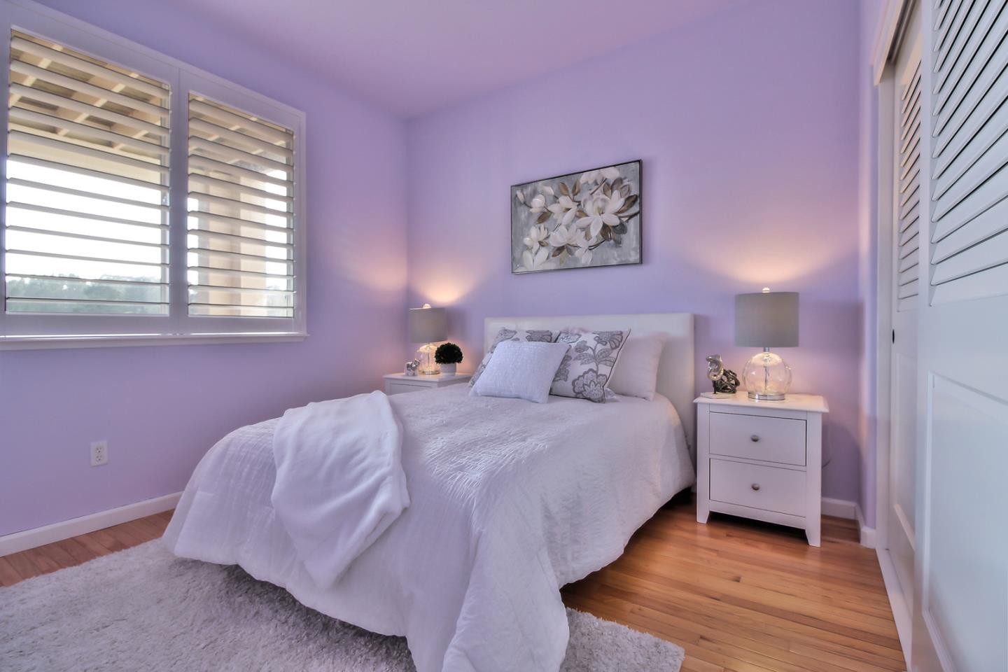 897 Skyridge Drive Pacifica, CA 94044 - Photo 23 of 37 a spacious bedroom with a bed and a window