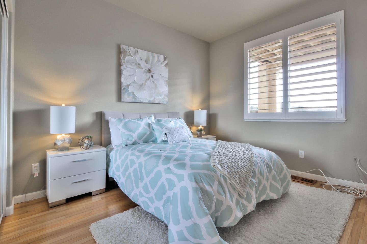 897 Skyridge Drive Pacifica, CA 94044 - Photo 24 of 37 a bedroom with a bed and a night stand