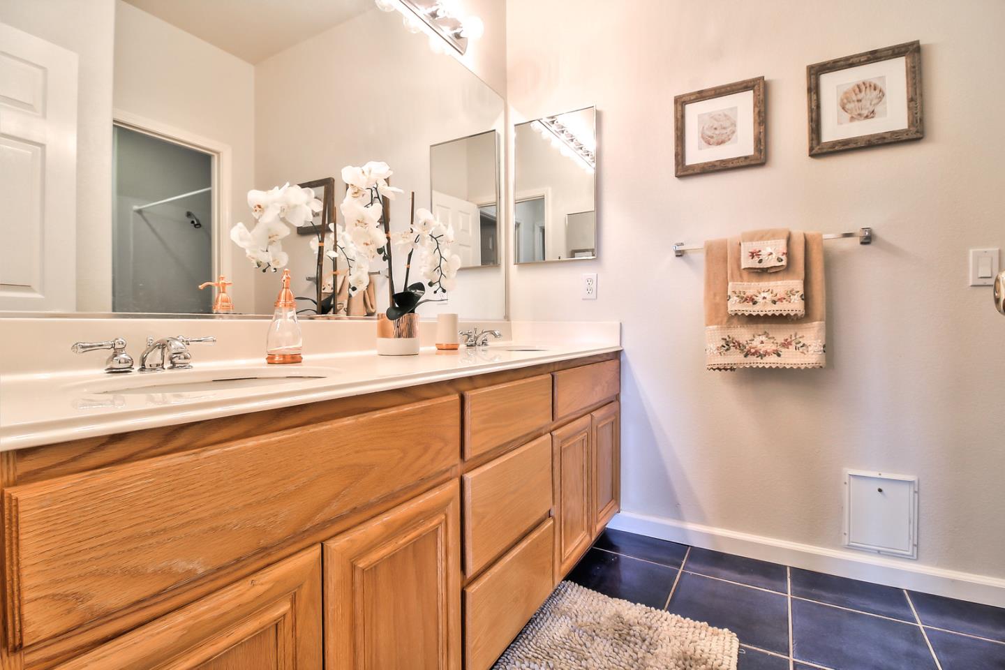897 Skyridge Drive Pacifica, CA 94044 - Photo 25 of 37 a bathroom with a sink and a mirror