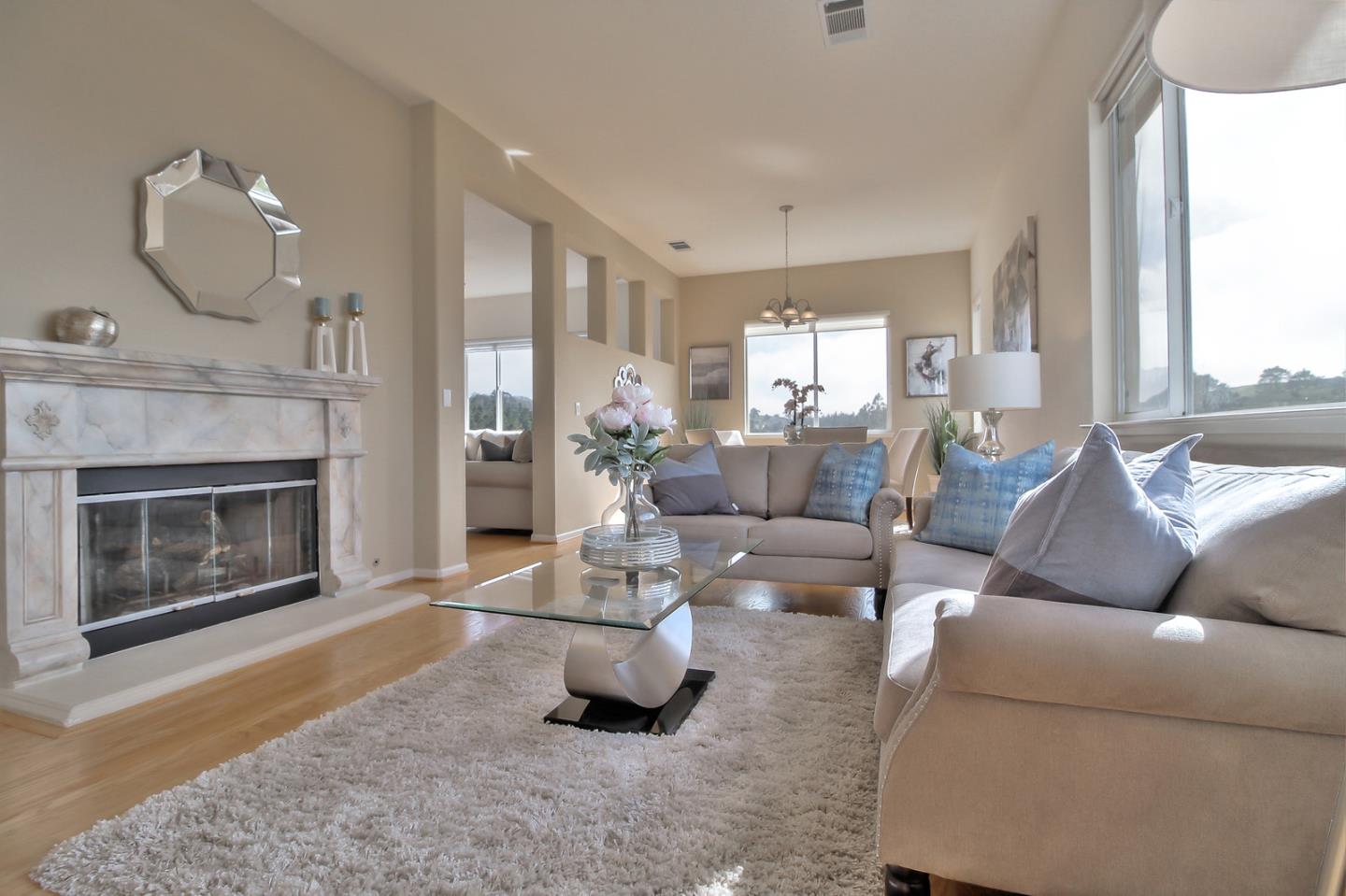 897 Skyridge Drive Pacifica, CA 94044 - Photo 4 of 37 a living room with furniture and a fireplace
