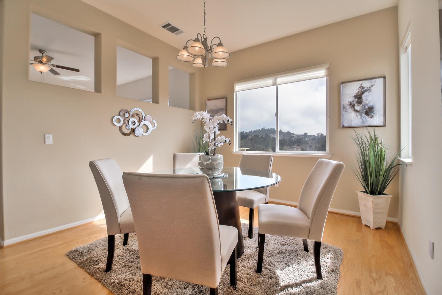 897 Skyridge Drive Pacifica, CA 94044 - Photo 6 of 37 a view of a dining room with furniture window and wooden floor