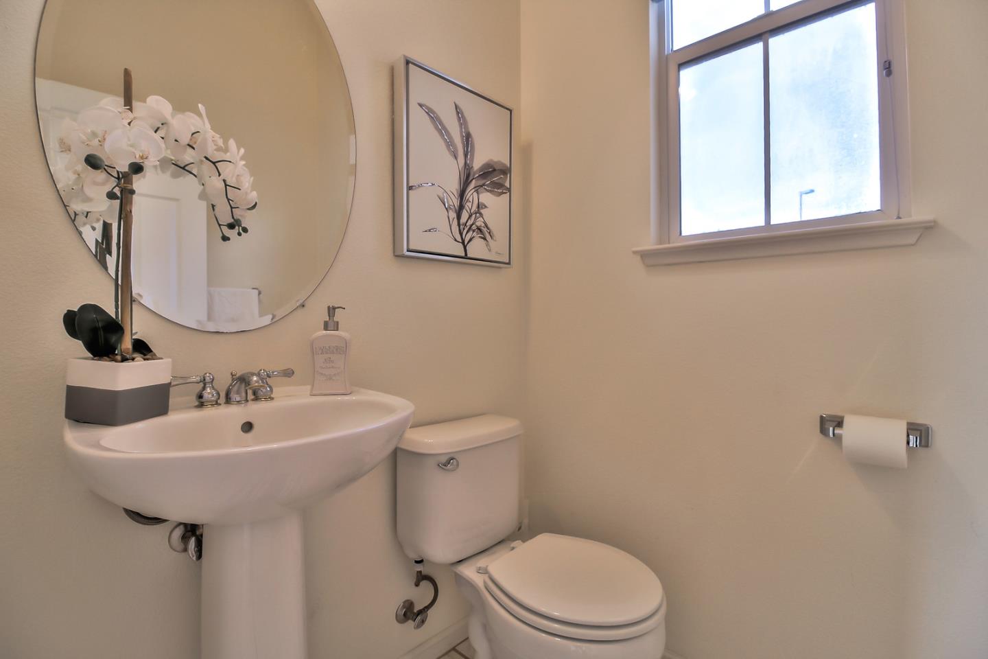 897 Skyridge Drive Pacifica, CA 94044 - Photo 9 of 37 a bathroom with a toilet sink and mirror