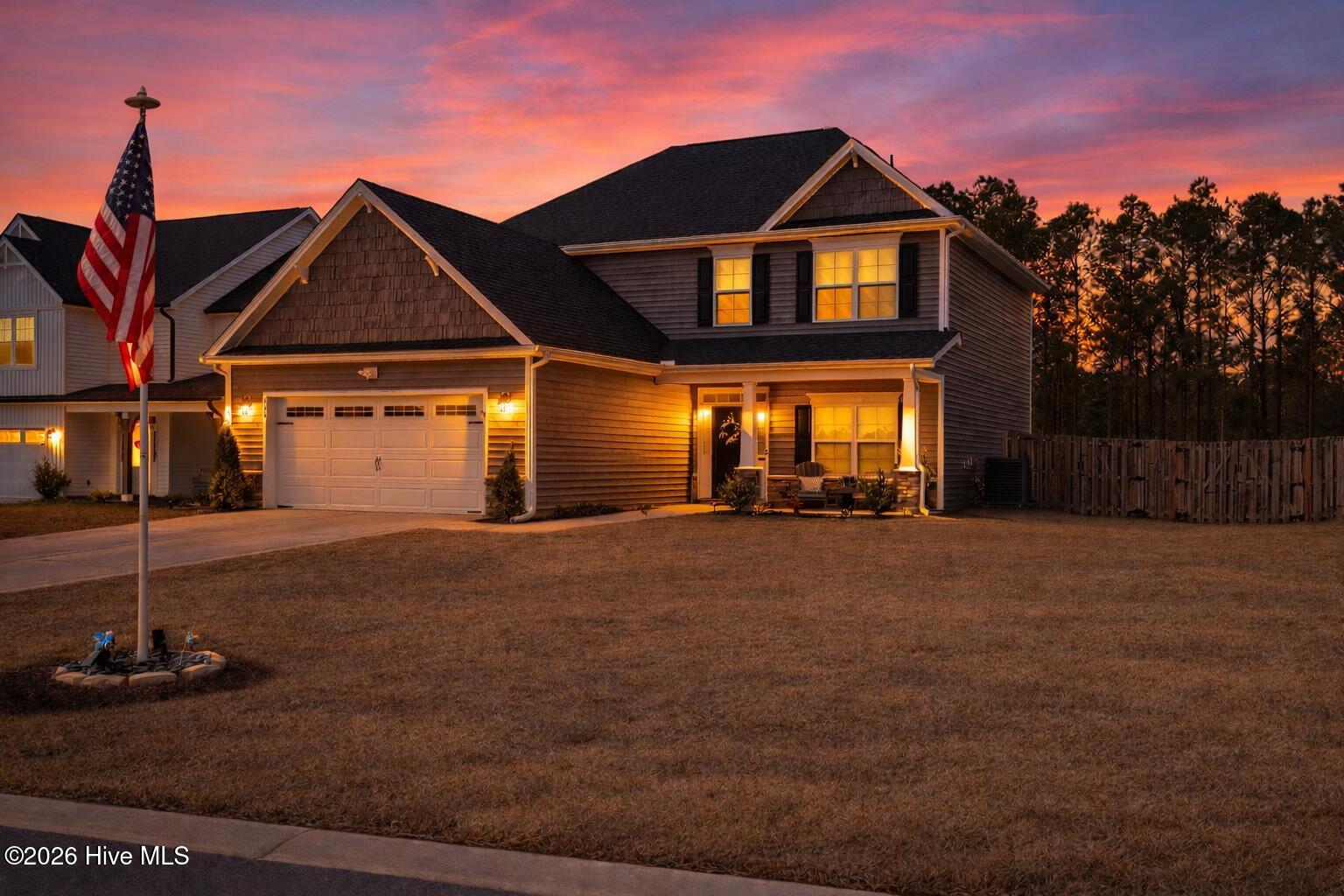 554 Transom Way Holly Ridge, NC 28445 - Photo 2 of 2 Sunset glow over suburban home
