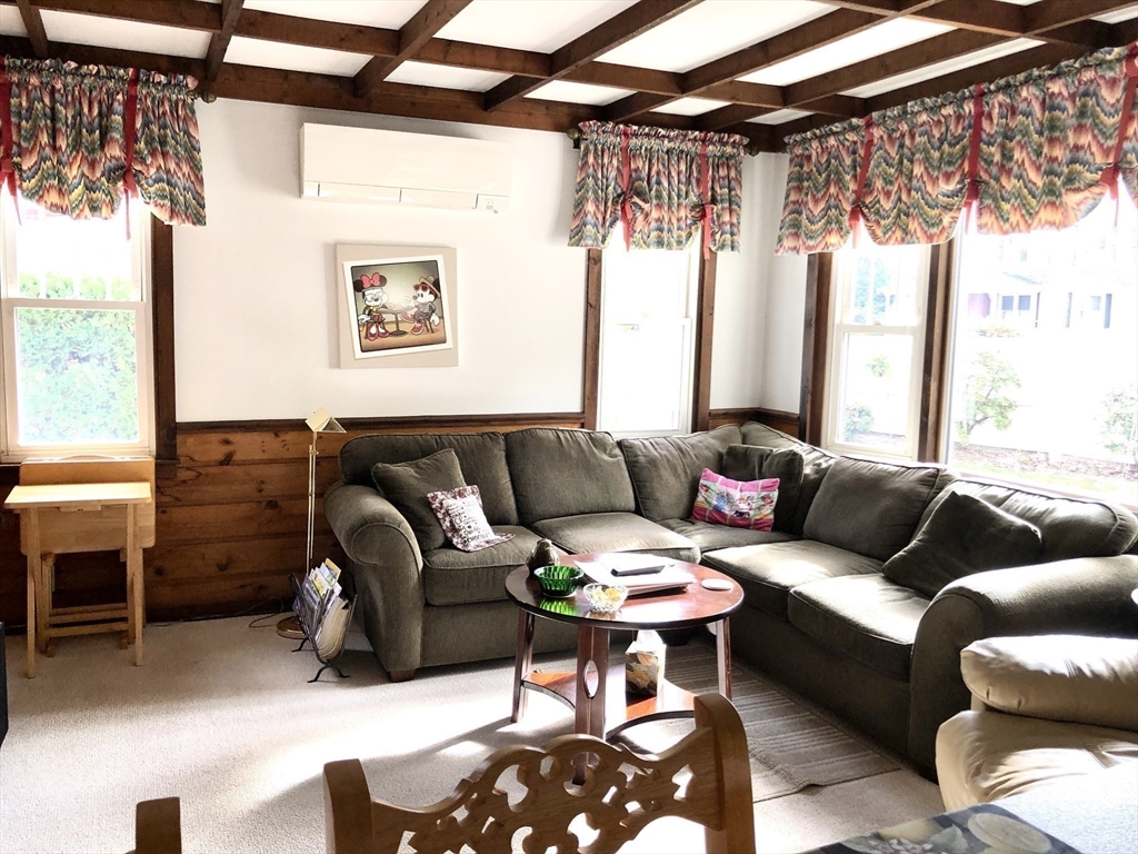 7 Ashbrook Street Springfield, MA 01118 - Photo 11 of 28 a living room with furniture and a large window