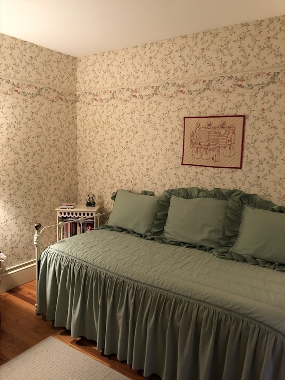 7 Ashbrook Street Springfield, MA 01118 - Photo 23 of 28 a bedroom with a bed and wall painting