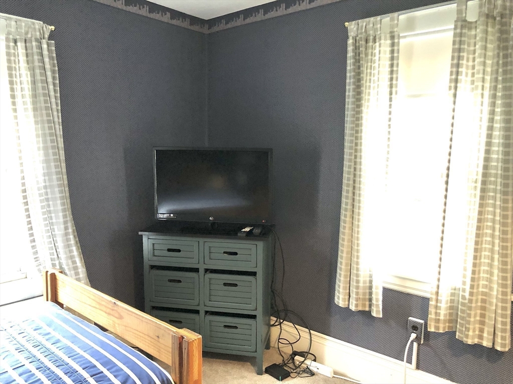 7 Ashbrook Street Springfield, MA 01118 - Photo 25 of 28 a living room with furniture and a flat screen tv