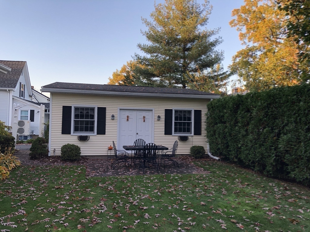 7 Ashbrook Street Springfield, MA 01118 - Photo 28 of 28 a backyard of a house with yard fire pit and outdoor seating