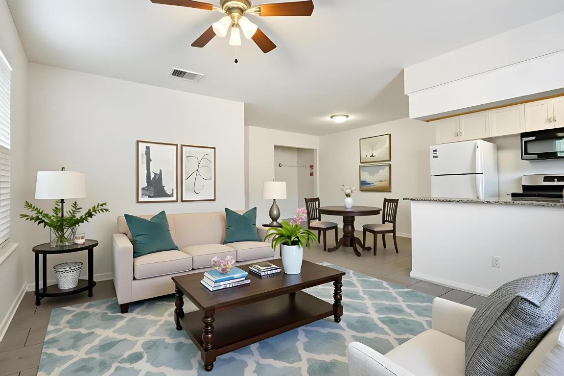 1115 Brookswood Avenue, Unit B Austin, TX 78721 - Photo 13 of 34 a living room with furniture and kitchen view