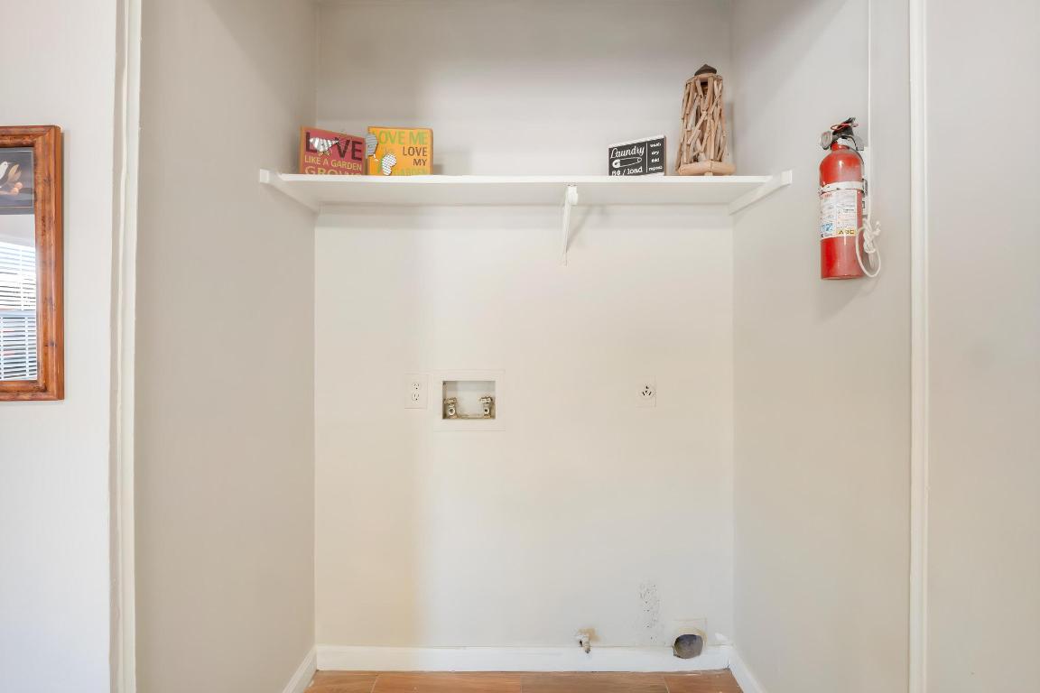 1115 Brookswood Avenue, Unit B Austin, TX 78721 - Photo 14 of 34 Laundry area with baseboards and washer hookup