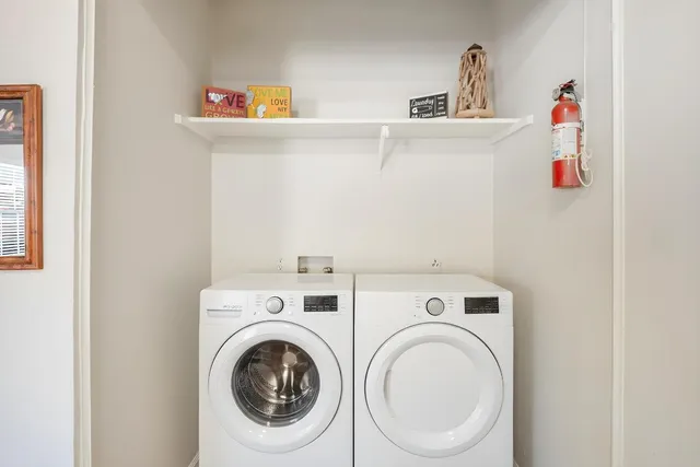 a large bed sitting in a bedroom next to a window