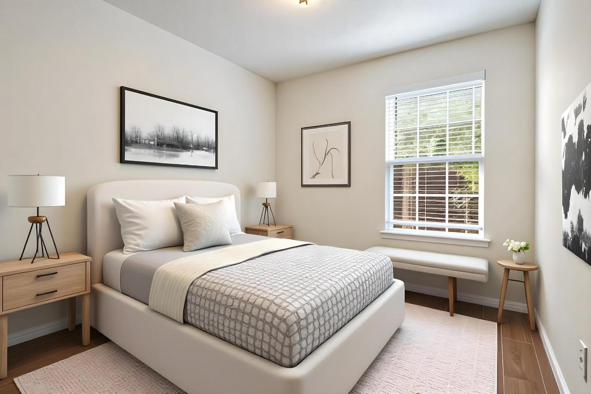 1115 Brookswood Avenue, Unit B Austin, TX 78721 - Photo 19 of 34 a bedroom with a bed and a window