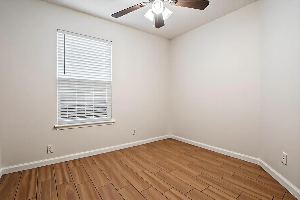 1115 Brookswood Avenue, Unit B Austin, TX 78721 - Photo 23 of 34 an empty room with a window