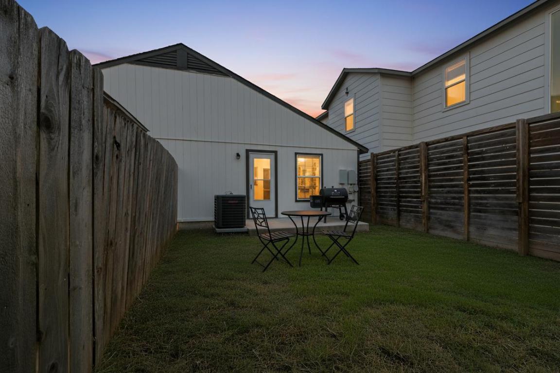 1115 Brookswood Avenue, Unit B Austin, TX 78721 - Photo 26 of 34 a view of backyard of house with table and chairs