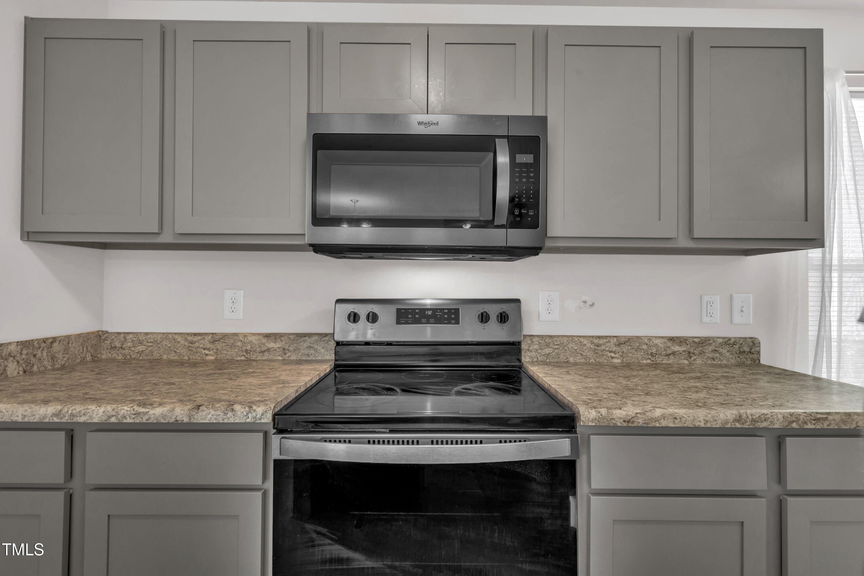 146 Maple Tree Lane Clayton, NC 27527 - Photo 16 of 50 a stove top oven sitting inside of a kitchen