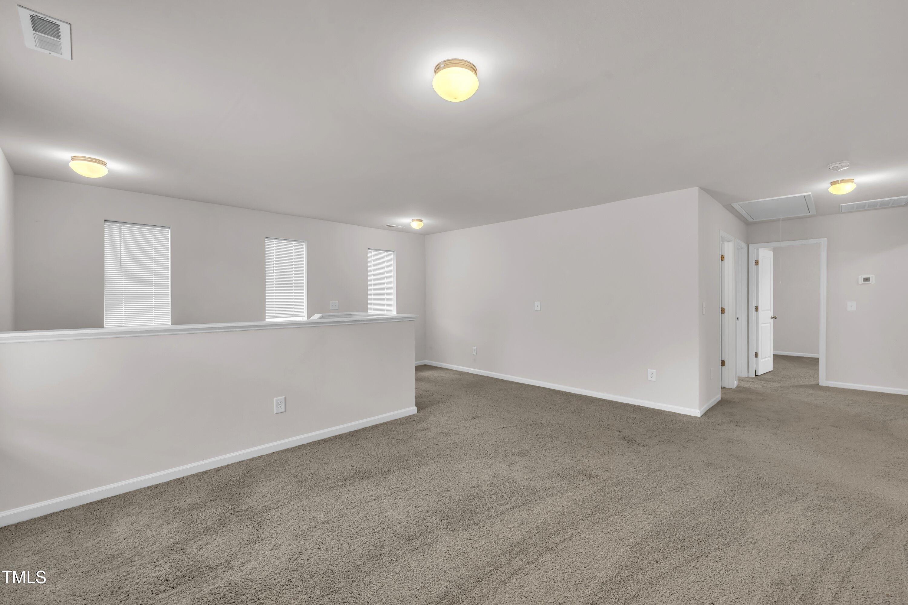 146 Maple Tree Lane Clayton, NC 27527 - Photo 28 of 50 a view of an empty room with a window