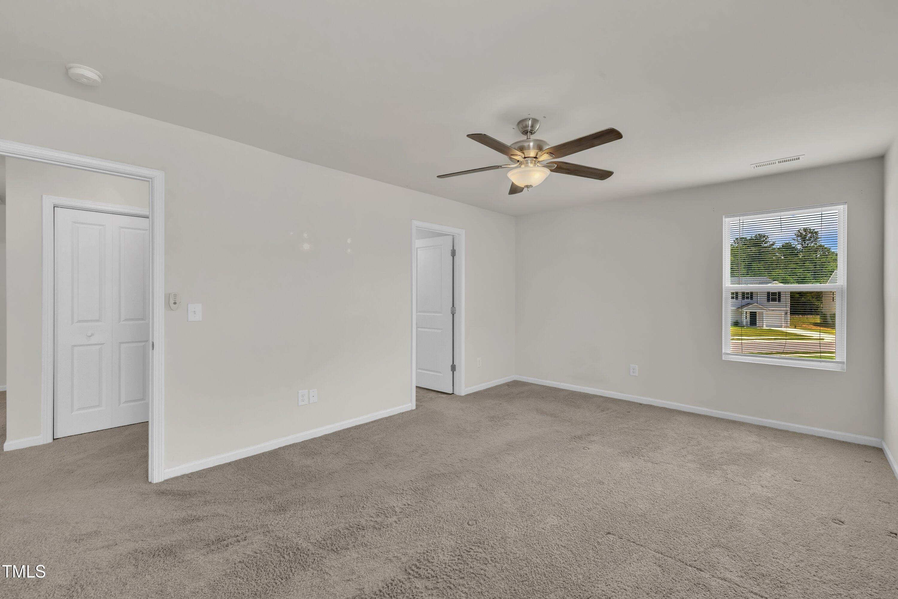 146 Maple Tree Lane Clayton, NC 27527 - Photo 34 of 50 a view of an empty room with a window