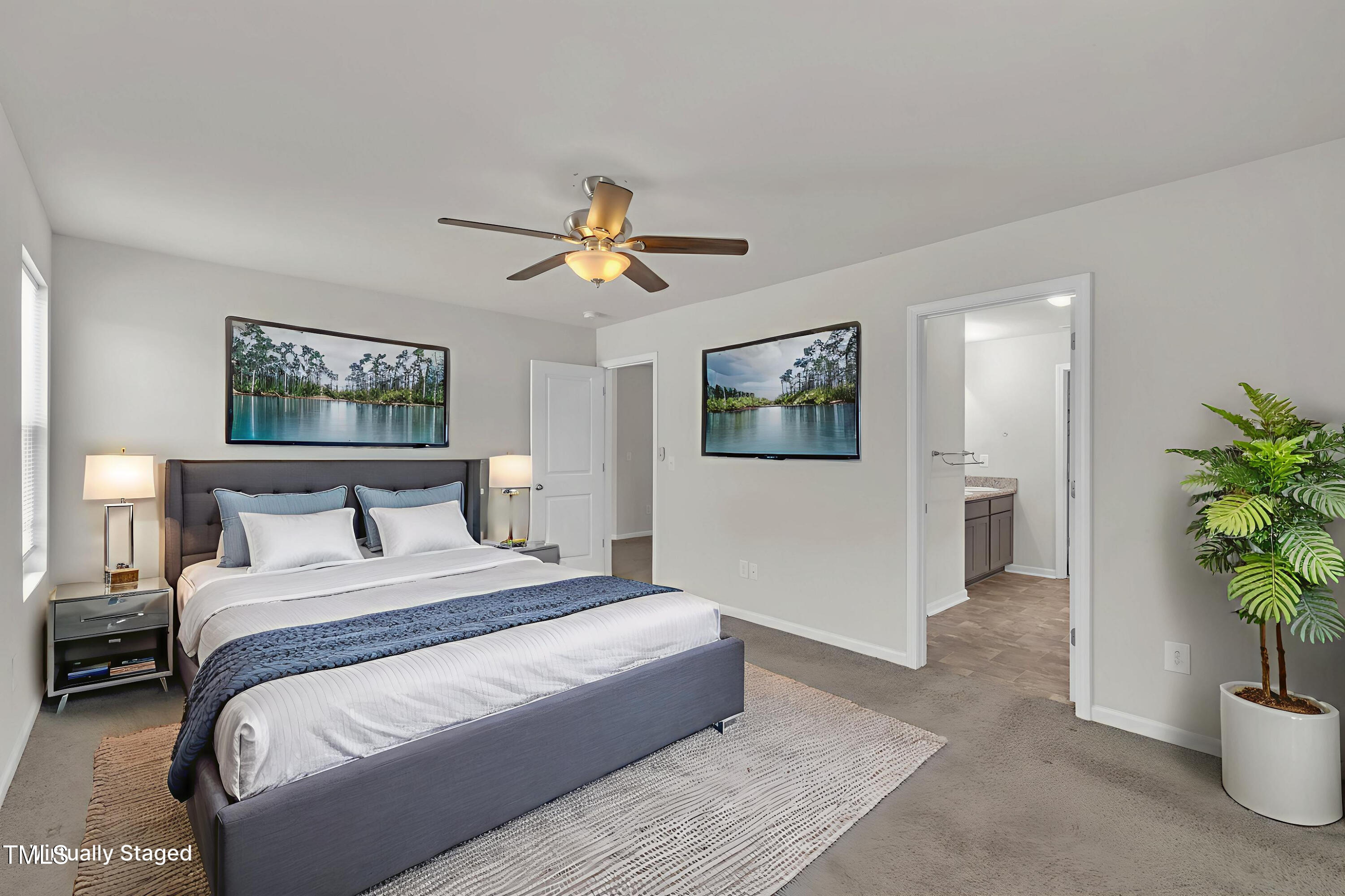 146 Maple Tree Lane Clayton, NC 27527 - Photo 36 of 50 a bedroom with a bed and a potted plant