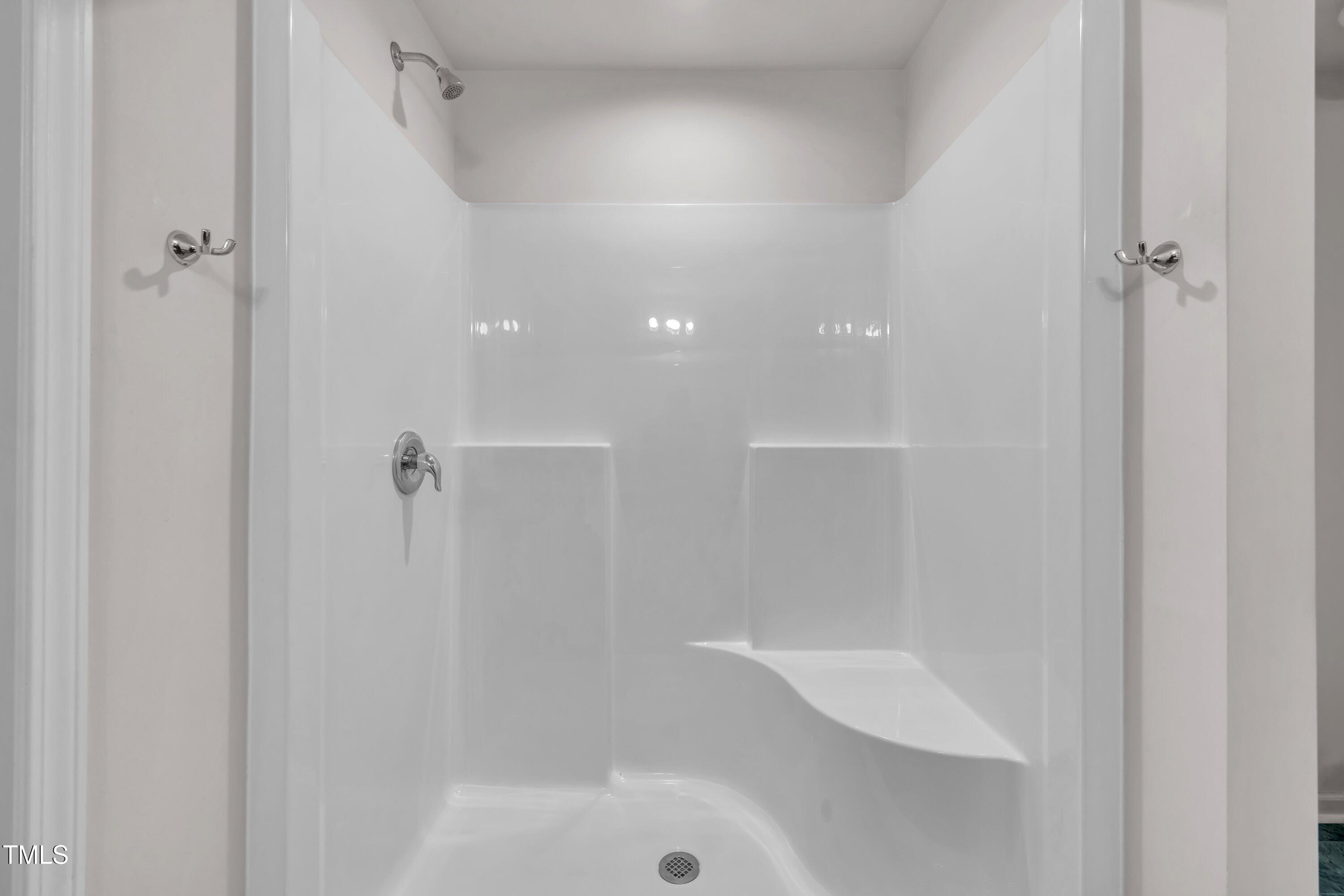 146 Maple Tree Lane Clayton, NC 27527 - Photo 41 of 50 a bathroom with a shower and bathtub