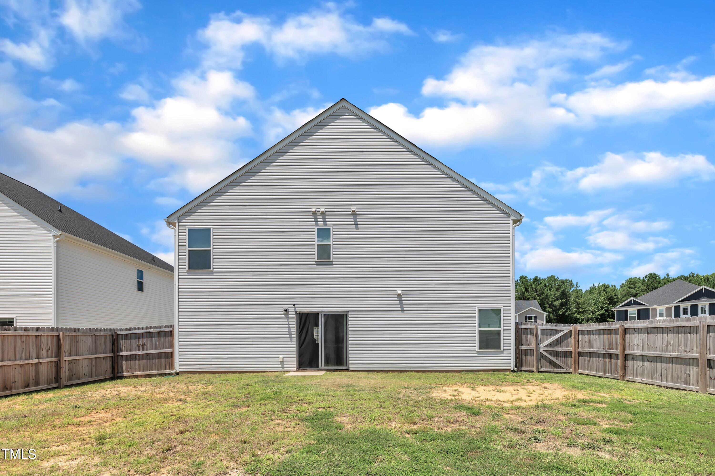 146 Maple Tree Lane Clayton, NC 27527 - Photo 47 of 50 a view of a house with a yard