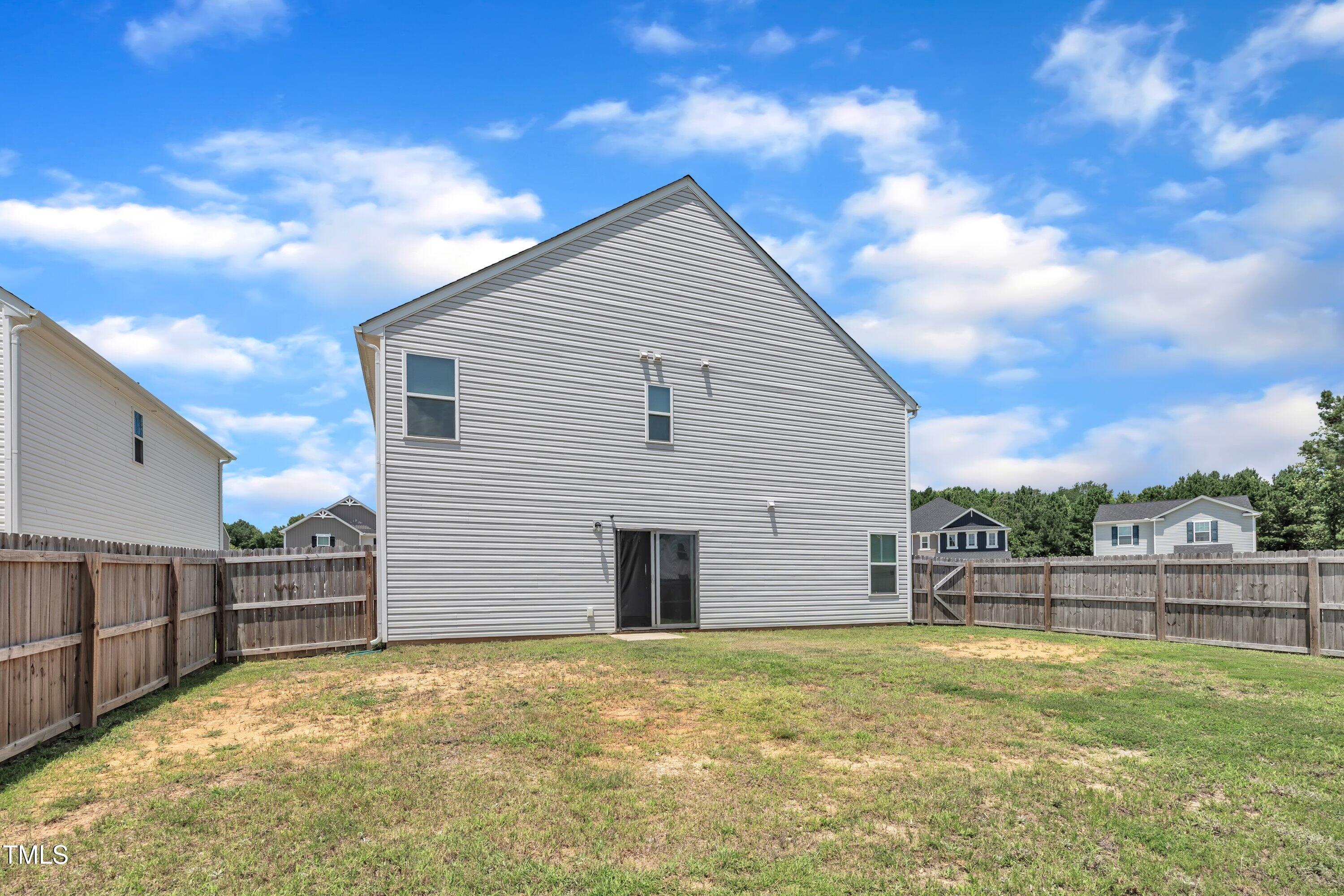 146 Maple Tree Lane Clayton, NC 27527 - Photo 48 of 50 a view of a house with a yard
