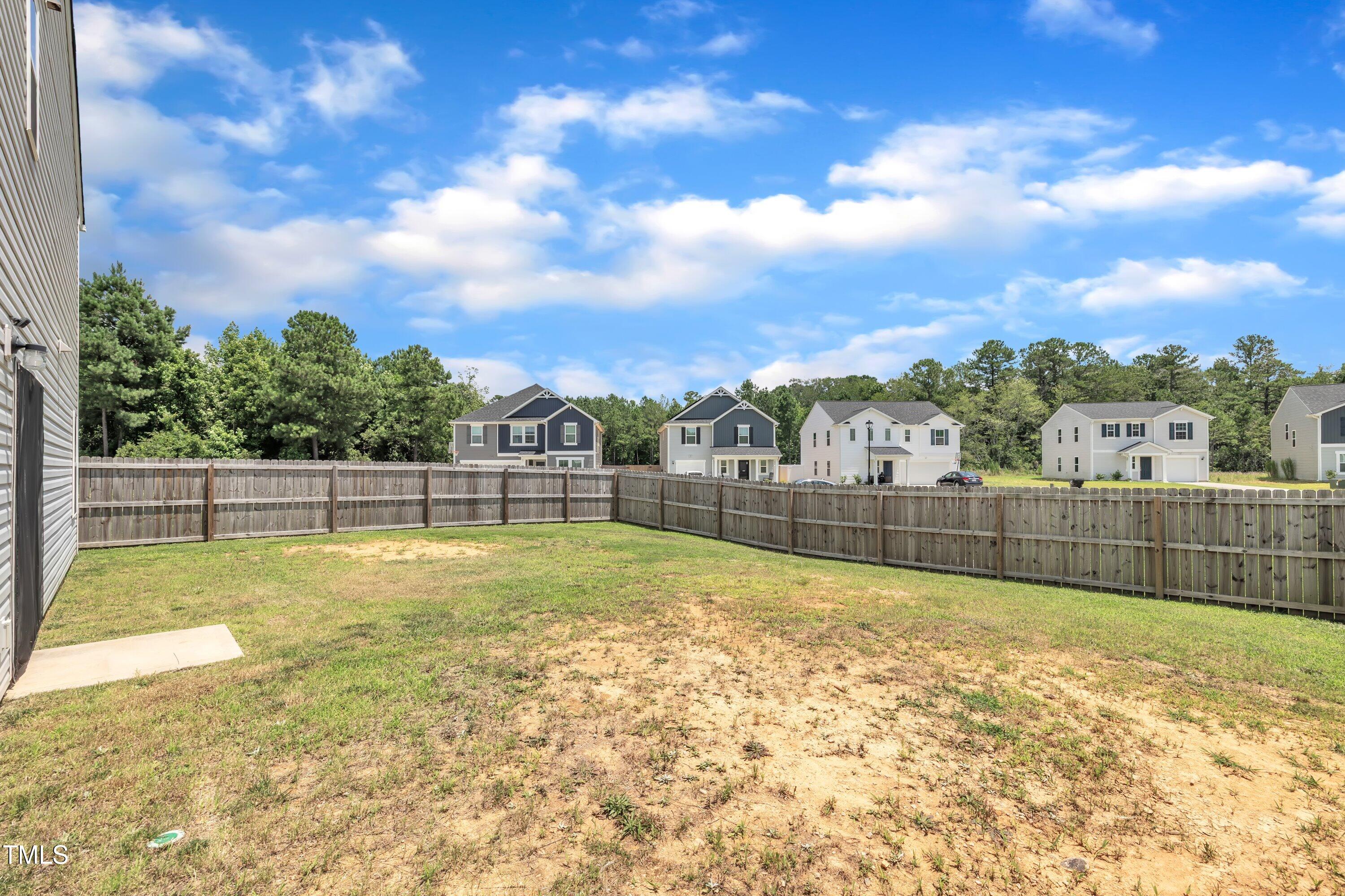 146 Maple Tree Lane Clayton, NC 27527 - Photo 49 of 50 a view of swimming pool with a yard