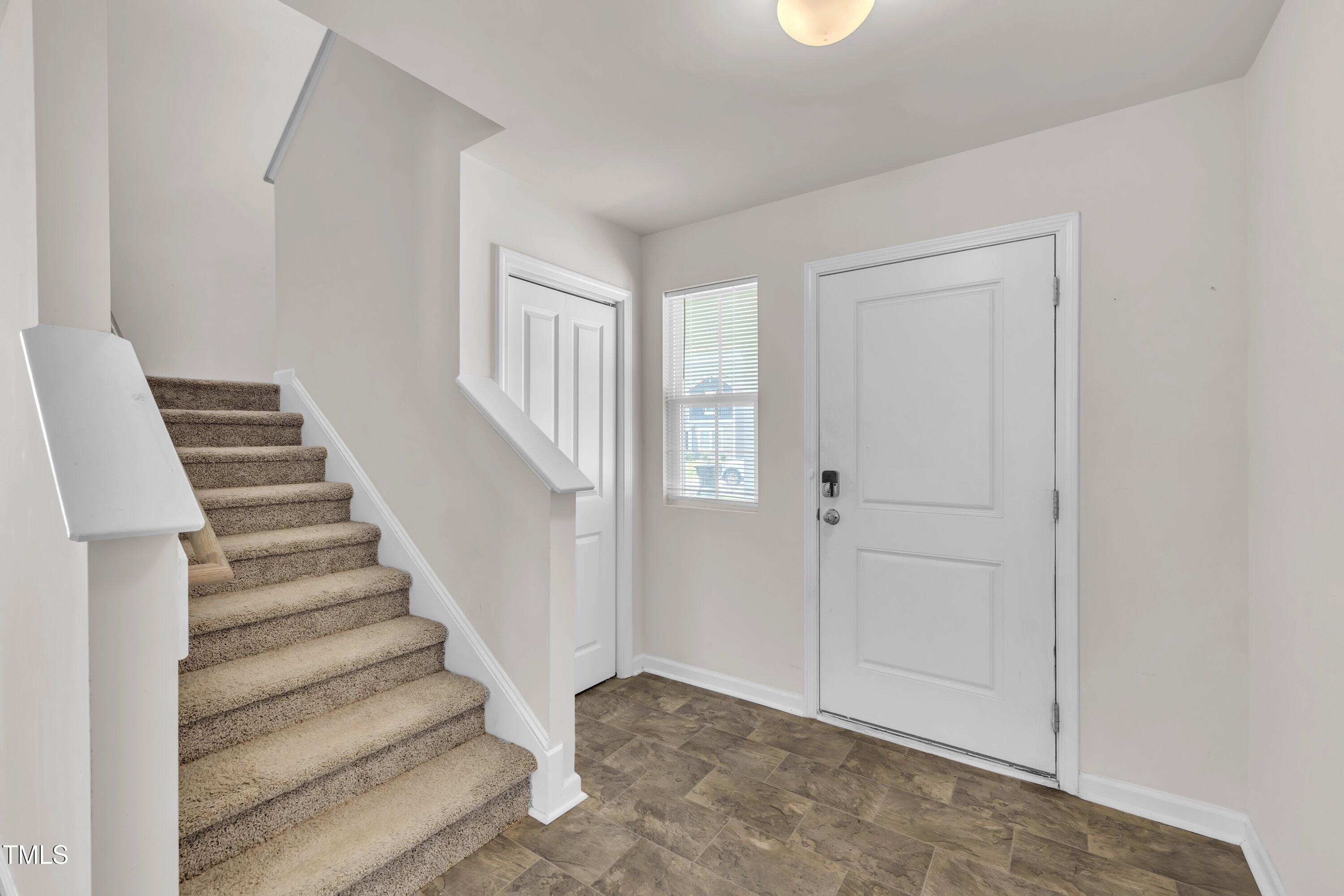 146 Maple Tree Lane Clayton, NC 27527 - Photo 5 of 50 a view of entryway with white walls and white door