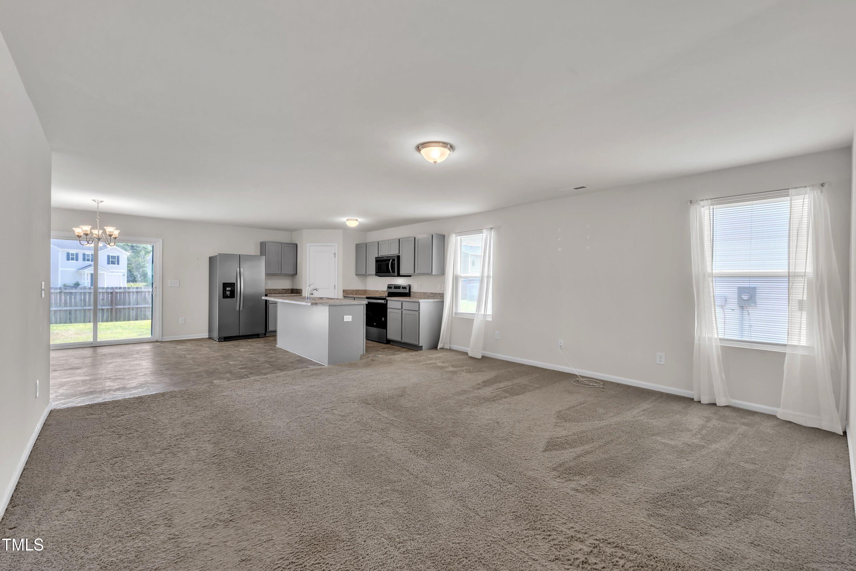 146 Maple Tree Lane Clayton, NC 27527 - Photo 6 of 50 a view of a kitchen with refrigerator and window