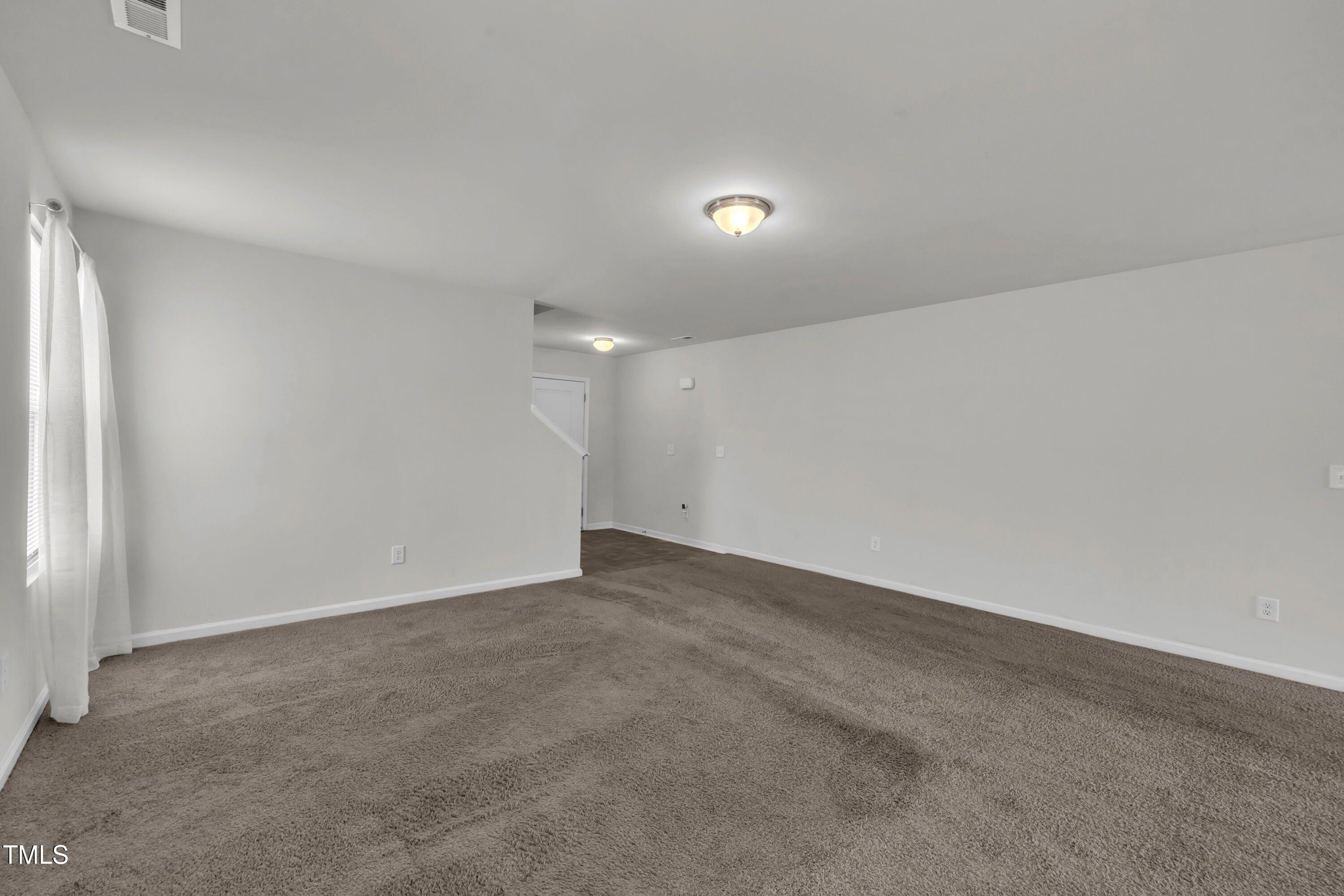 146 Maple Tree Lane Clayton, NC 27527 - Photo 9 of 50 a view of an empty room