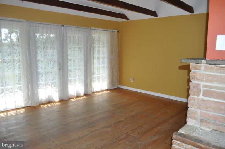 1559 Stone Chapel Road New Windsor, MD 21776 - Photo 1 of 12 VIEW INTO LIVING ROOM FROM KITCHEN
