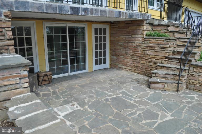 1559 Stone Chapel Road New Windsor, MD 21776 - Photo 9 of 12 STONE ENTRY TO LOWER LEVEL LIVING AREA