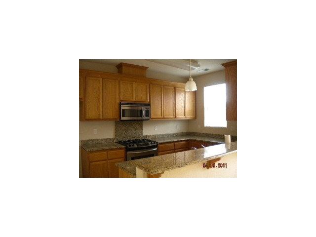 26 Oliveira Loop Watsonville, CA 95019 - Photo 3 of 9 a kitchen with a sink and cabinets