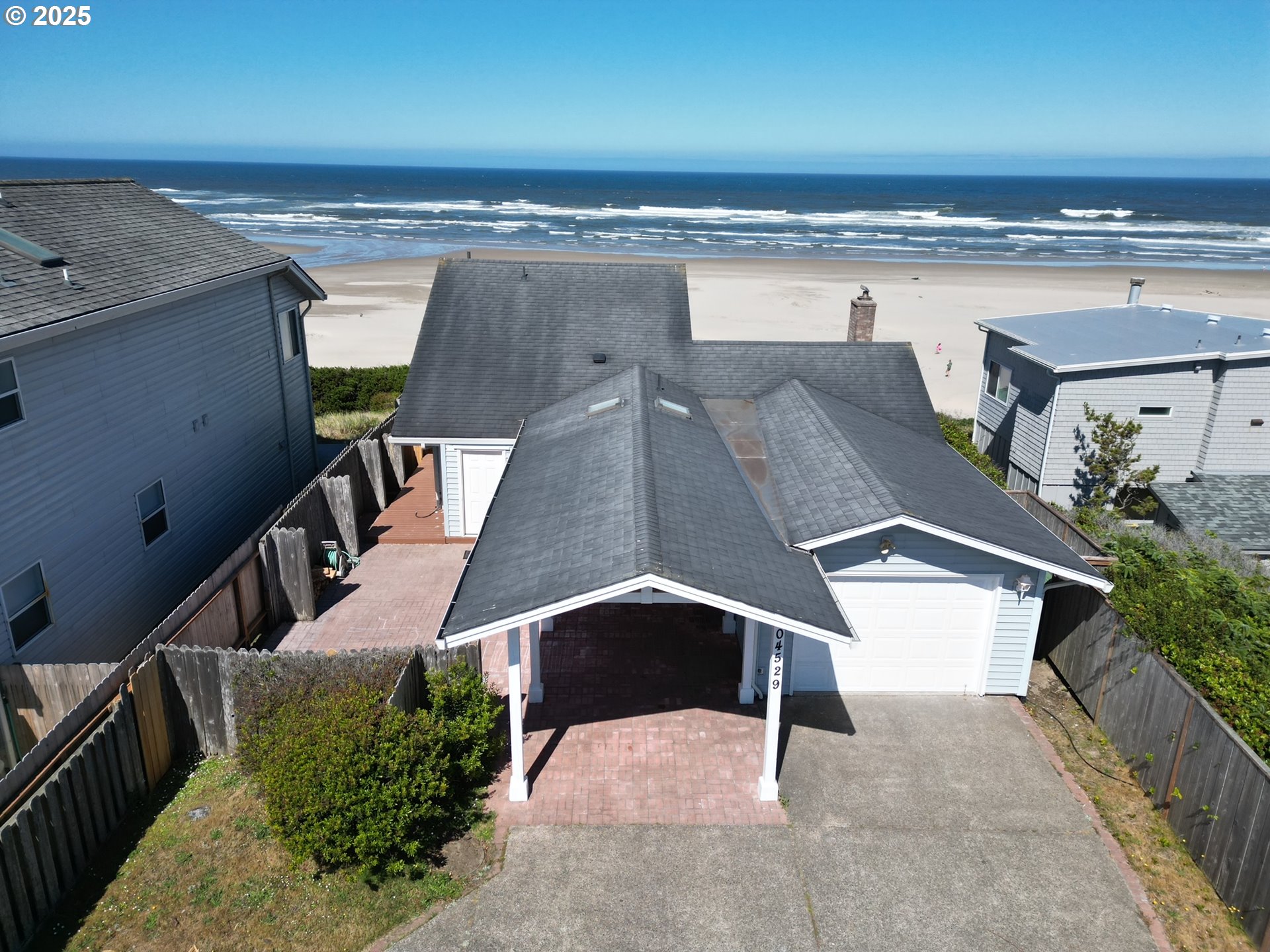 an aerial view of a house with outdoor space