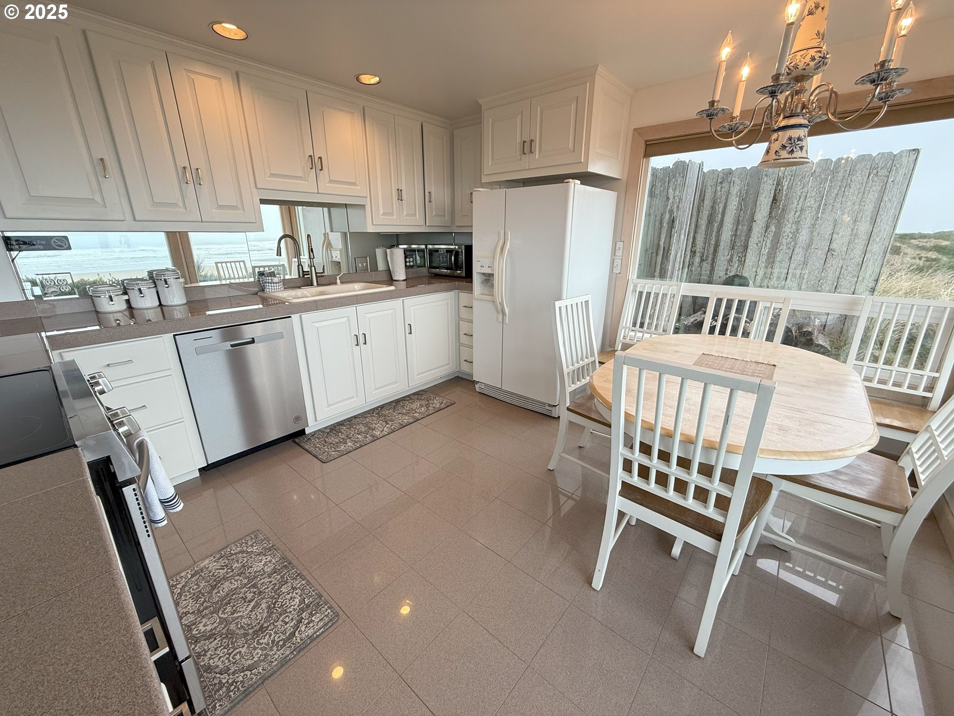 4529 Lookout Street Florence, OR 97439 - Photo 13 of 46 a kitchen with cabinets and chairs