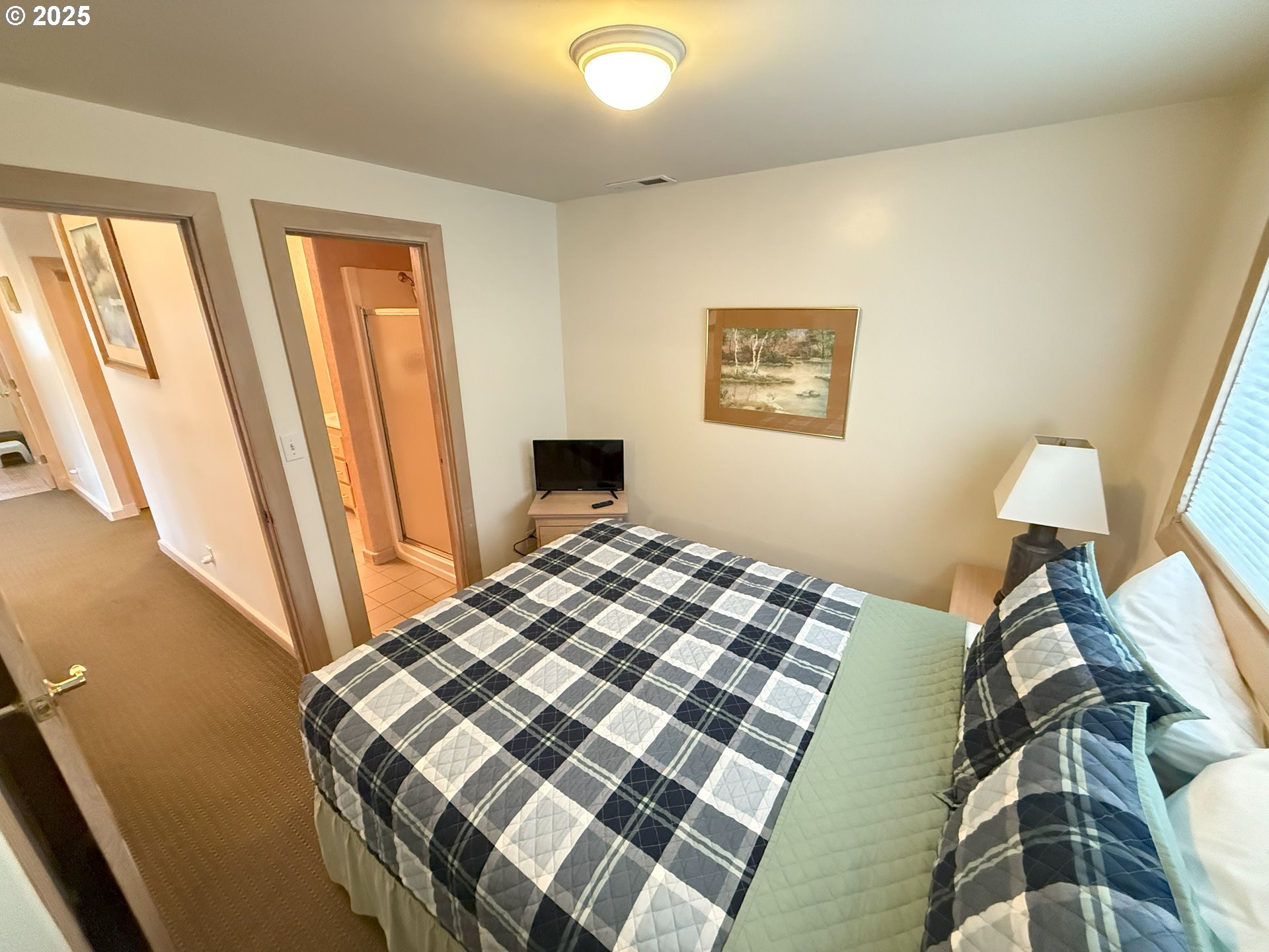 4529 Lookout Street Florence, OR 97439 - Photo 22 of 46 a bedroom with a bed and a window
