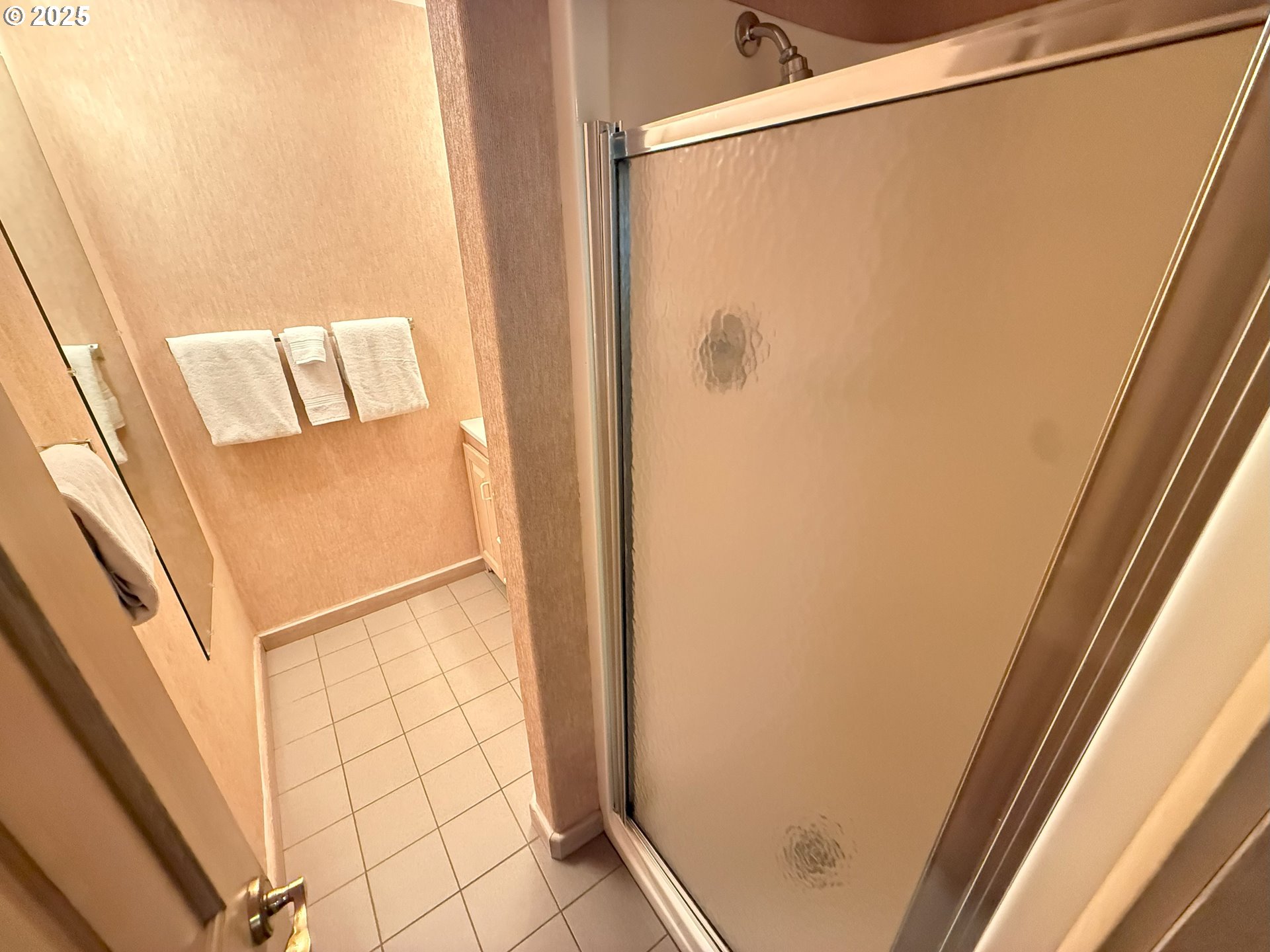 4529 Lookout Street Florence, OR 97439 - Photo 23 of 46 a bathroom with a glass shower door
