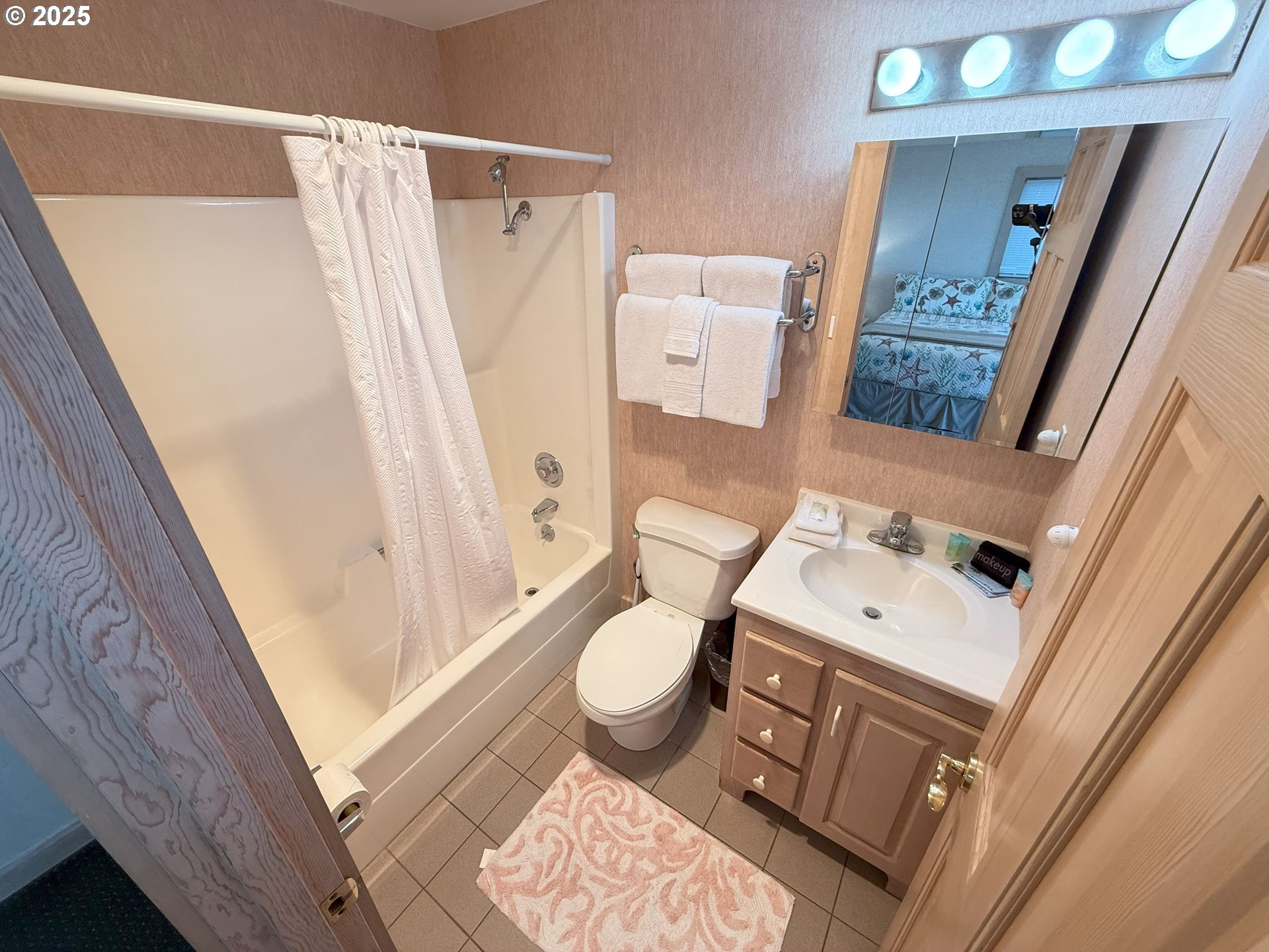 4529 Lookout Street Florence, OR 97439 - Photo 28 of 46 a bathroom with a sink toilet and shower