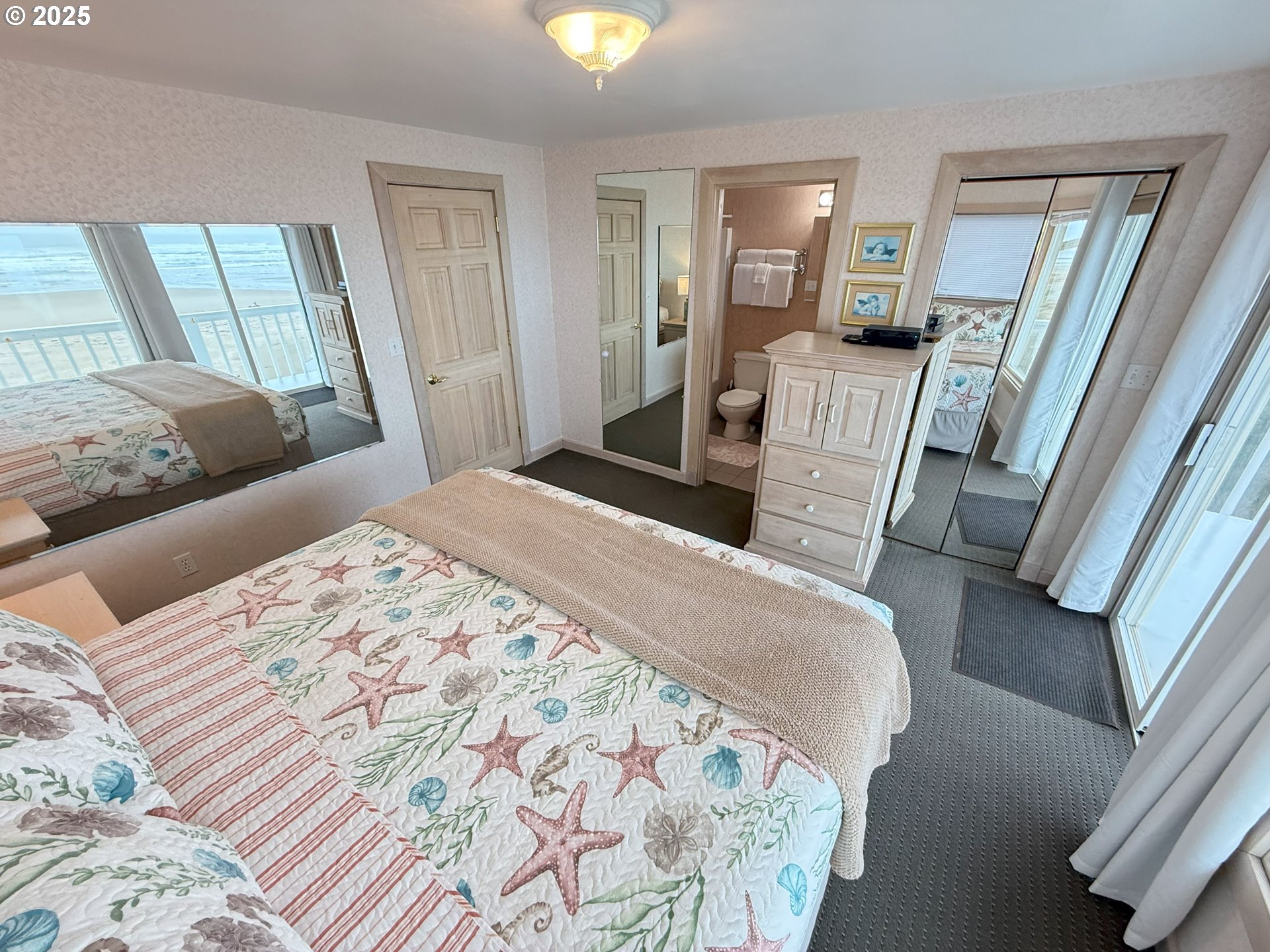 4529 Lookout Street Florence, OR 97439 - Photo 29 of 46 a bedroom with a bed and wooden floor