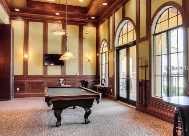 a reading room with furniture and a window